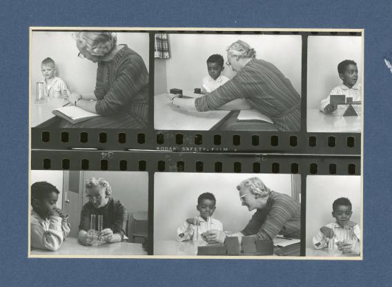 Line of photo negatives from the 1950s showing a woman demonstrating to small children