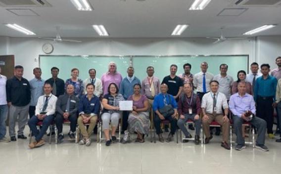 Posed photo of large group in a classroom